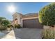 Well maintained home with a two-car garage and nicely manicured landscaping at 21720 N 265Th Dr, Buckeye, AZ 85396