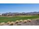 Golf course with green and sand traps, mountain backdrop at 21720 N 265Th Dr, Buckeye, AZ 85396