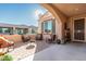 Relaxing patio with comfortable seating and a fire pit at 21720 N 265Th Dr, Buckeye, AZ 85396