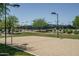 Beach volleyball court with sand and lights at 21720 N 265Th Dr, Buckeye, AZ 85396