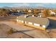 Aerial view showcasing a house with a large lot and mountain backdrop at 22352 W Meade Ln, Buckeye, AZ 85326