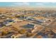 Aerial image showcasing a house and surrounding vacant land in a residential neighborhood at 22352 W Meade Ln, Buckeye, AZ 85326