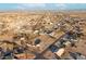 Wide aerial view of a suburban neighborhood, featuring a single-Gathering home and vacant lots at 22352 W Meade Ln, Buckeye, AZ 85326