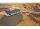 Aerial view of a house with a shed and surrounding vacant land at 22352 W Meade Ln, Buckeye, AZ 85326