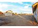 Large empty backyard with shed and tire tracks at 22352 W Meade Ln, Buckeye, AZ 85326