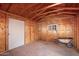 Simple shed interior with wooden walls and floor at 22352 W Meade Ln, Buckeye, AZ 85326