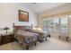 Spacious bedroom with twin beds, ample closet space and large window at 22915 N Wagon Wheel Dr, Sun City West, AZ 85375