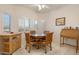 Cozy breakfast nook with wood table and chairs, perfect for morning meals at 22915 N Wagon Wheel Dr, Sun City West, AZ 85375