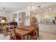 Dining room with a wooden table and kitchen views at 22915 N Wagon Wheel Dr, Sun City West, AZ 85375