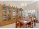 Dining area with a wooden table and hutch at 22915 N Wagon Wheel Dr, Sun City West, AZ 85375