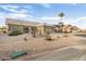 Front view of a one-story house with a gravel yard at 22915 N Wagon Wheel Dr, Sun City West, AZ 85375