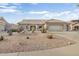 Single-story home with desert landscaping and a two-car garage at 22915 N Wagon Wheel Dr, Sun City West, AZ 85375