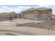 Two-car garage with a curved driveway at 22915 N Wagon Wheel Dr, Sun City West, AZ 85375