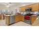 Bright kitchen with stainless steel appliances and granite countertops at 22915 N Wagon Wheel Dr, Sun City West, AZ 85375