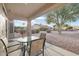 Relaxing covered patio with outdoor furniture and view of the backyard at 22915 N Wagon Wheel Dr, Sun City West, AZ 85375