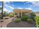 Landscaped backyard with pergola covered patio and gravel at 23313 N De La Guerra Ct, Sun City West, AZ 85375