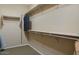 Spacious walk-in closet with ample shelving and hanging space at 23313 N De La Guerra Ct, Sun City West, AZ 85375