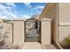 Ornate iron gate leading to a private courtyard at 23313 N De La Guerra Ct, Sun City West, AZ 85375