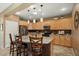 Spacious kitchen with granite countertops and light wood cabinets at 23313 N De La Guerra Ct, Sun City West, AZ 85375