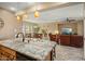 Open kitchen with granite island, looking toward the living room at 23313 N De La Guerra Ct, Sun City West, AZ 85375