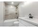 Updated bathroom featuring modern tile surround on the shower and tub at 2345 W Monroe St # 4, Phoenix, AZ 85009