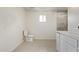 Bright bathroom featuring a toilet, a sink, and a tiled shower at 2345 W Monroe St # 4, Phoenix, AZ 85009