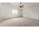 Spacious bedroom with neutral carpet and a modern ceiling fan at 2345 W Monroe St # 4, Phoenix, AZ 85009