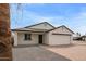 Charming single Gathering home with a brick paver driveway and a white exterior at 2345 W Monroe St # 4, Phoenix, AZ 85009