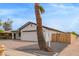 Charming single Gathering home with a brick paver driveway and a white exterior at 2345 W Monroe St # 4, Phoenix, AZ 85009