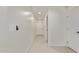 Bright hallway with tile floors, white walls, and recessed lighting at 2345 W Monroe St # 4, Phoenix, AZ 85009