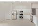 Modern kitchen featuring stainless steel appliances and bright white cabinetry at 2345 W Monroe St # 4, Phoenix, AZ 85009