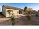 Inviting backyard with drought-resistant landscaping and a covered patio at 2471 E Jade Dr, Chandler, AZ 85286