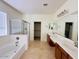 Spacious bathroom with double vanity, soaking tub, and walk-in shower at 2471 E Jade Dr, Chandler, AZ 85286