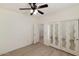 Comfortable bedroom with wood-look flooring and mirrored closet doors at 2471 E Jade Dr, Chandler, AZ 85286