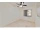 Bright bedroom with neutral tile flooring, a ceiling fan, and a window with blinds at 2471 E Jade Dr, Chandler, AZ 85286