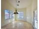 Bright dining room with large windows and a stylish light fixture at 2471 E Jade Dr, Chandler, AZ 85286