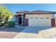 Single-story home with tile roof, two-car garage, and desert landscaping at 2471 E Jade Dr, Chandler, AZ 85286