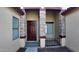 Front entry with a dark brown door and stone pillars at 2471 E Jade Dr, Chandler, AZ 85286