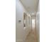 Neutral hallway featuring wall niche shelving and tile flooring at 2471 E Jade Dr, Chandler, AZ 85286