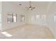 Bright living room with neutral tones, vaulted ceilings, and tile flooring at 2471 E Jade Dr, Chandler, AZ 85286