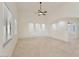 Spacious living room featuring high ceilings, travertine floors, and three decorative wall niches at 2471 E Jade Dr, Chandler, AZ 85286