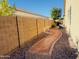 Side yard with gravel pathway and block wall at 2471 E Jade Dr, Chandler, AZ 85286