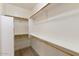 Walk-in closet featuring custom shelves and wood rods at 2471 E Jade Dr, Chandler, AZ 85286