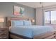 Bright bedroom with light blue bedding and wood frame bed at 2524 S El Paradiso Dr # 70, Mesa, AZ 85202