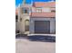 Townhouse exterior with a two-car garage and Spanish-style tile roof at 2524 S El Paradiso Dr # 70, Mesa, AZ 85202