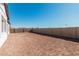 Large backyard with block wall and plenty of space for landscaping at 2553 E Virginia Cir, Mesa, AZ 85213