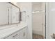 Modern bathroom with white vanity, gold fixtures, and bathtub at 2553 E Virginia Cir, Mesa, AZ 85213