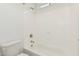 Clean bathroom with shower/tub combo and white tile at 2553 E Virginia Cir, Mesa, AZ 85213