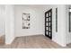 Bright and airy entryway with tile floors and contemporary wall art at 2553 E Virginia Cir, Mesa, AZ 85213