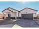 New construction home with a welcoming front porch and attractive landscaping at 2553 E Virginia Cir, Mesa, AZ 85213